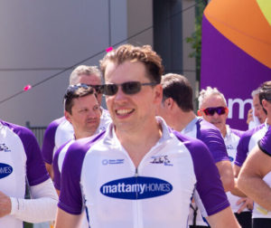 Luke Gilgan with 2019 Tour de Bleu participants at finish line